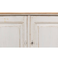 Detail of doors on whitewash painted buffet.