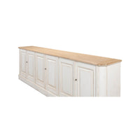 Side angle of whitewash painted buffet highlighting design.