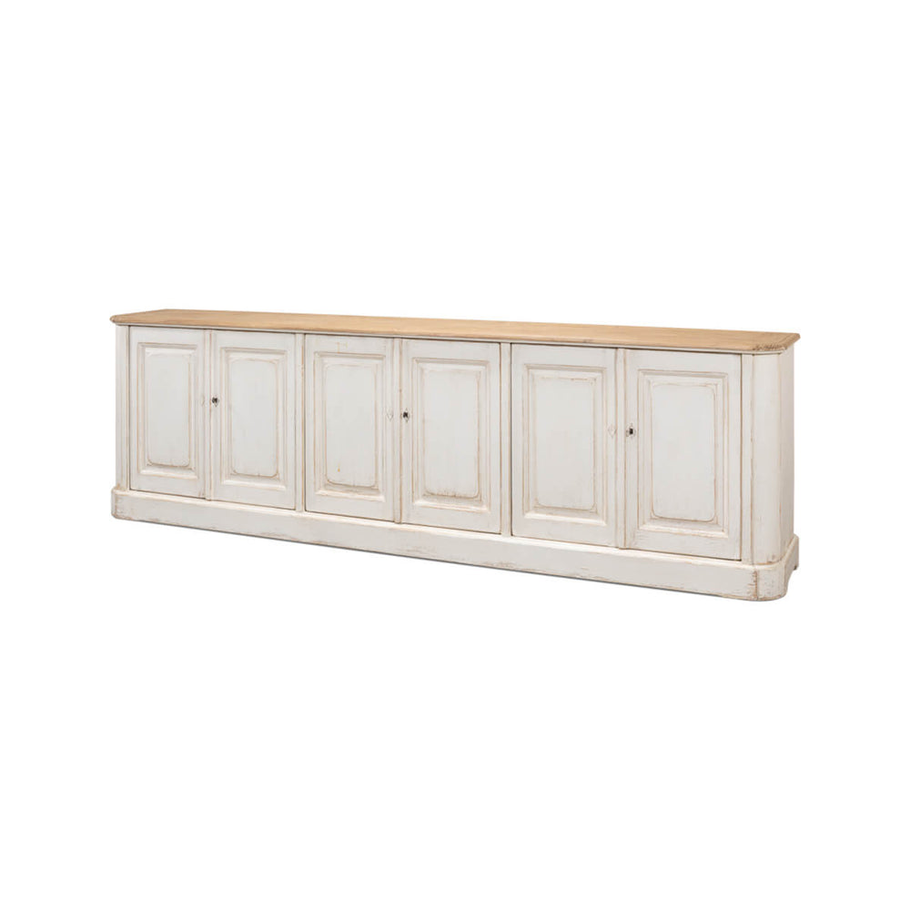 Angled view of whitewash painted buffet with wooden top.