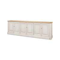 Angled view of whitewash painted buffet with wooden top.