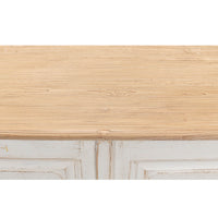 Wooden surface close-up on whitewash painted buffet.