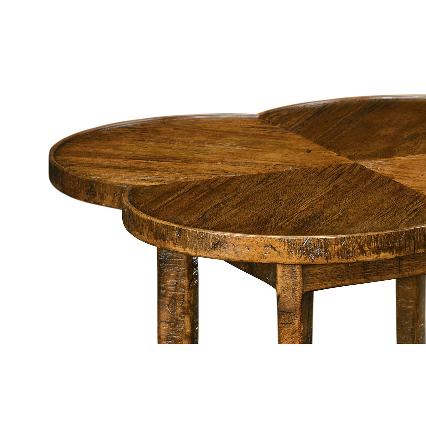 Close-up of walnut quatrefoil table top detail.