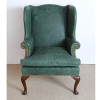 Front view of Queen Anne style leather wingchair.