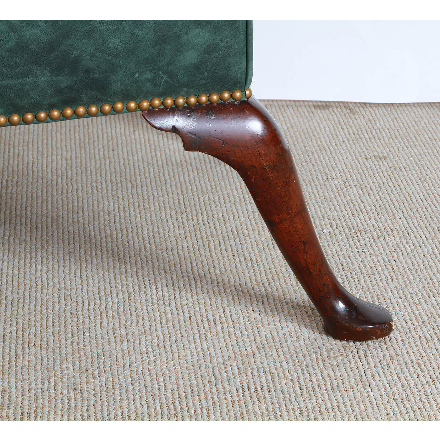 Side view of leg design, showcasing wood craftsmanship.
