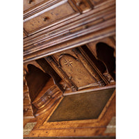 Ornate carvings inside Queen Anne secretary bookcase, star motif.