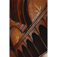Arched detailing on Queen Anne secretary bookcase upper section.