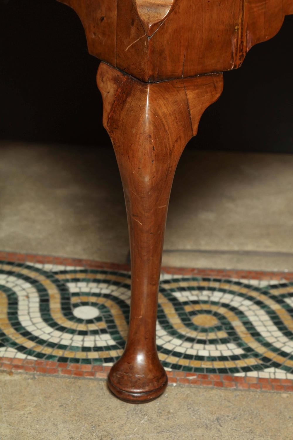 Close-up of front leg on Queen Anne walnut lowboy.