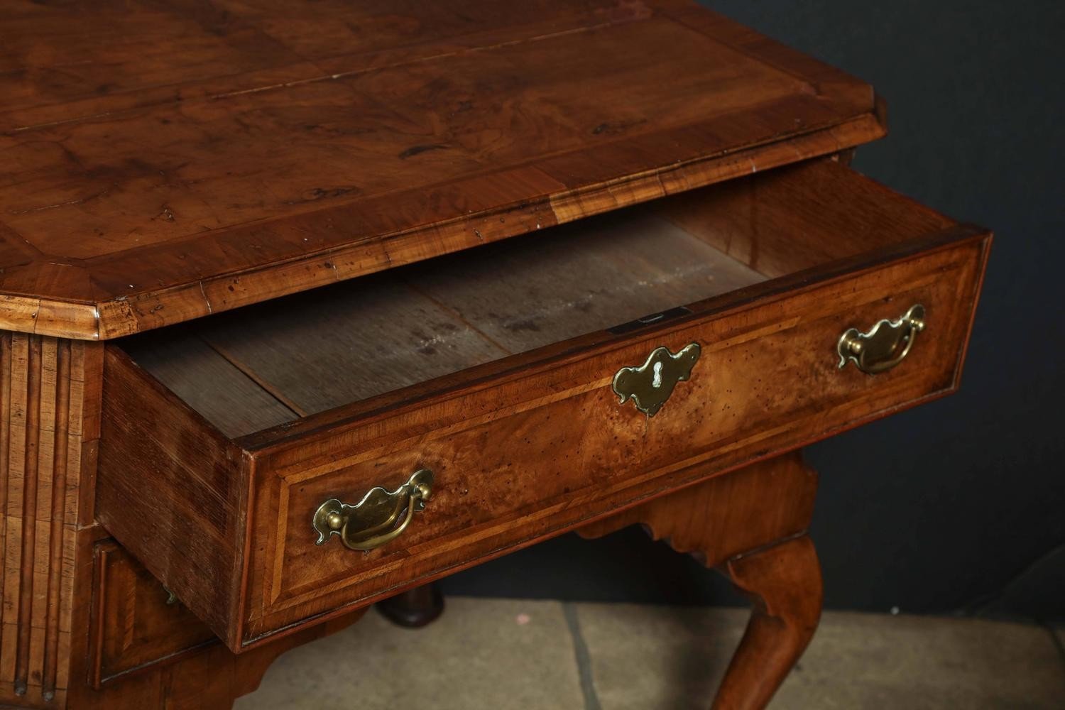 Open drawer of Queen Anne walnut lowboy, interior view.