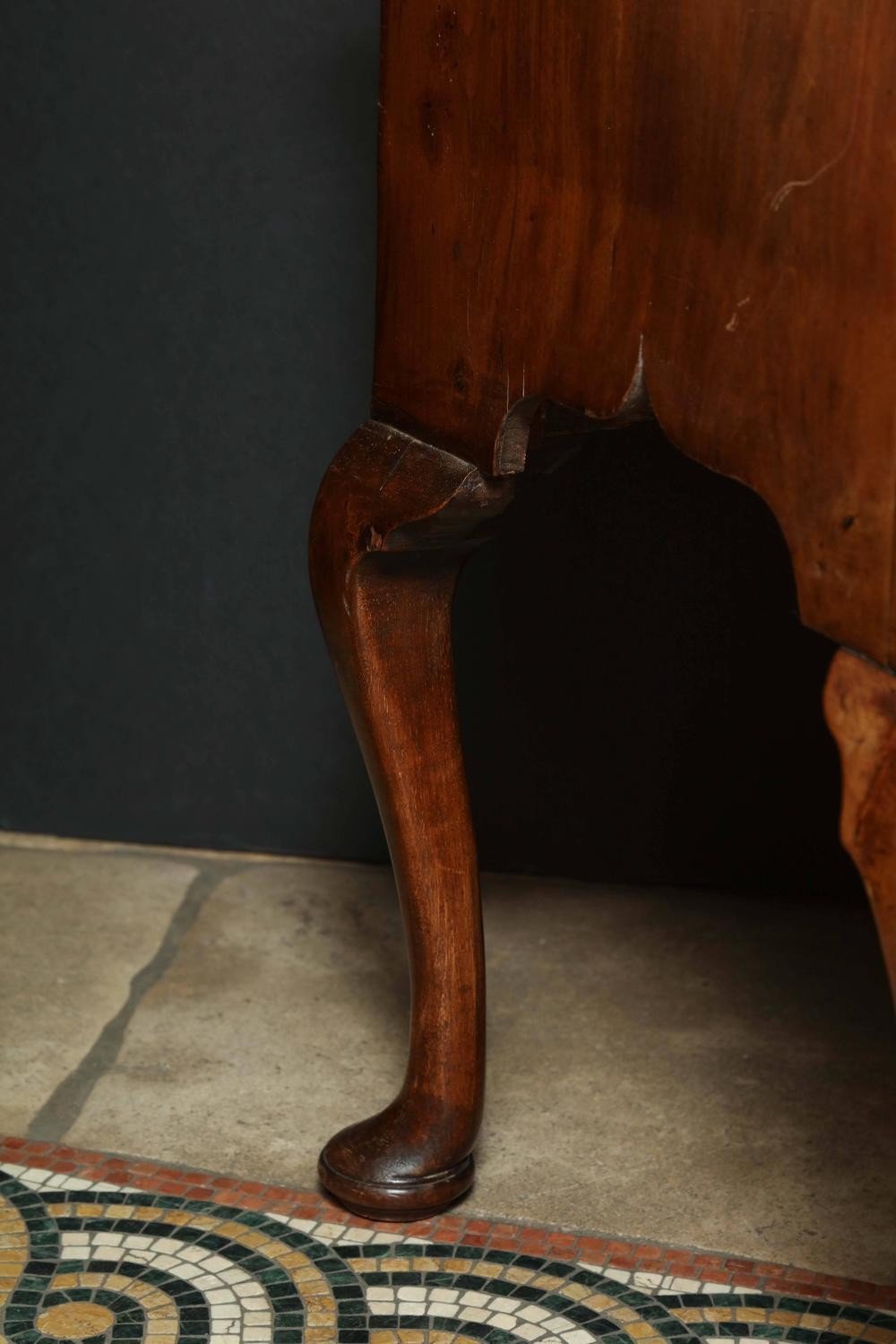 Side leg detail of Queen Anne walnut lowboy.