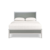 Queen bed, front view with crisp white bedding.