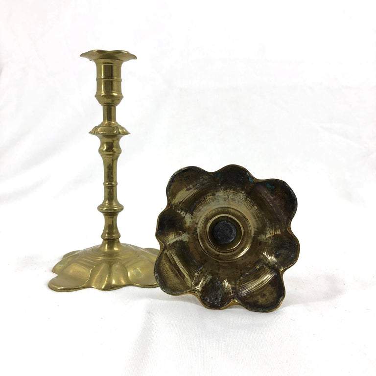 Queen Anne brass candlesticks base detail and standing.