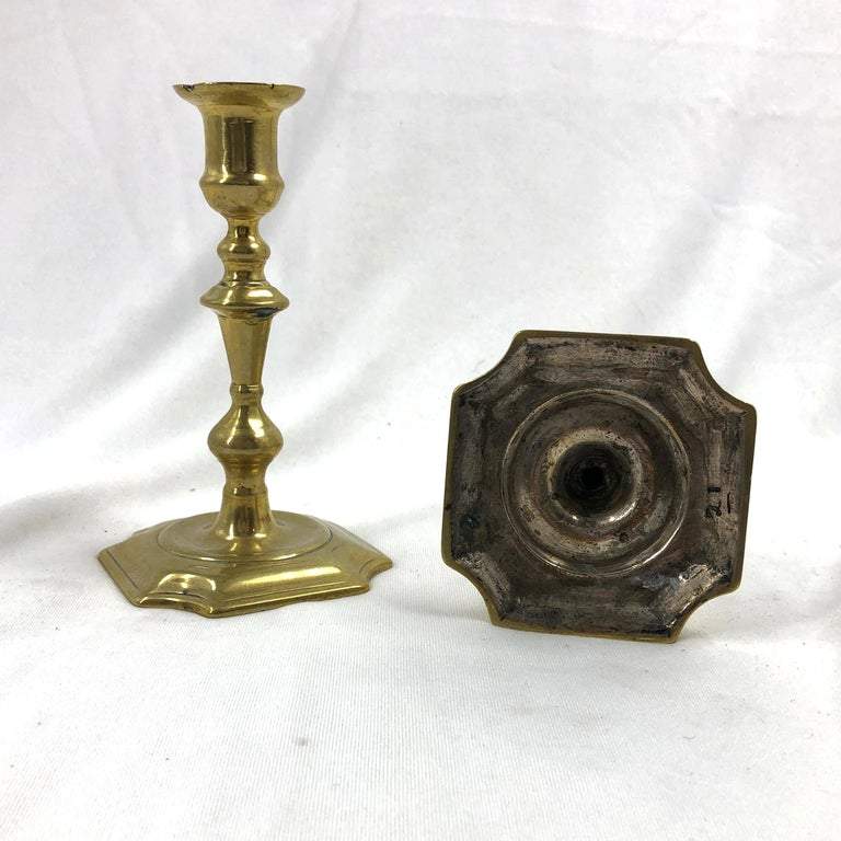 Underside detail of one Queen Anne candlestick base.
