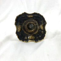 Bottom view of Queen Anne brass candlestick, antique finish.