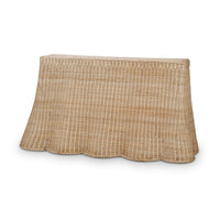 Rattan console table front view with scalloped edge.