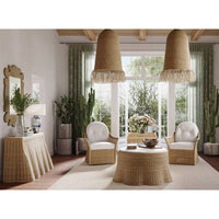 Rattan console table in living room setting with decor.