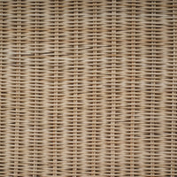 Detailed texture of rattan console table surface.