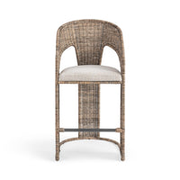 Front view of the natural rattan counter stool with a curved woven back and slim footrest