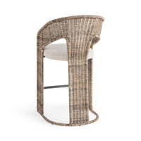 Three-quarter rear view of the rattan counter stool showing its woven back panel and rounded base