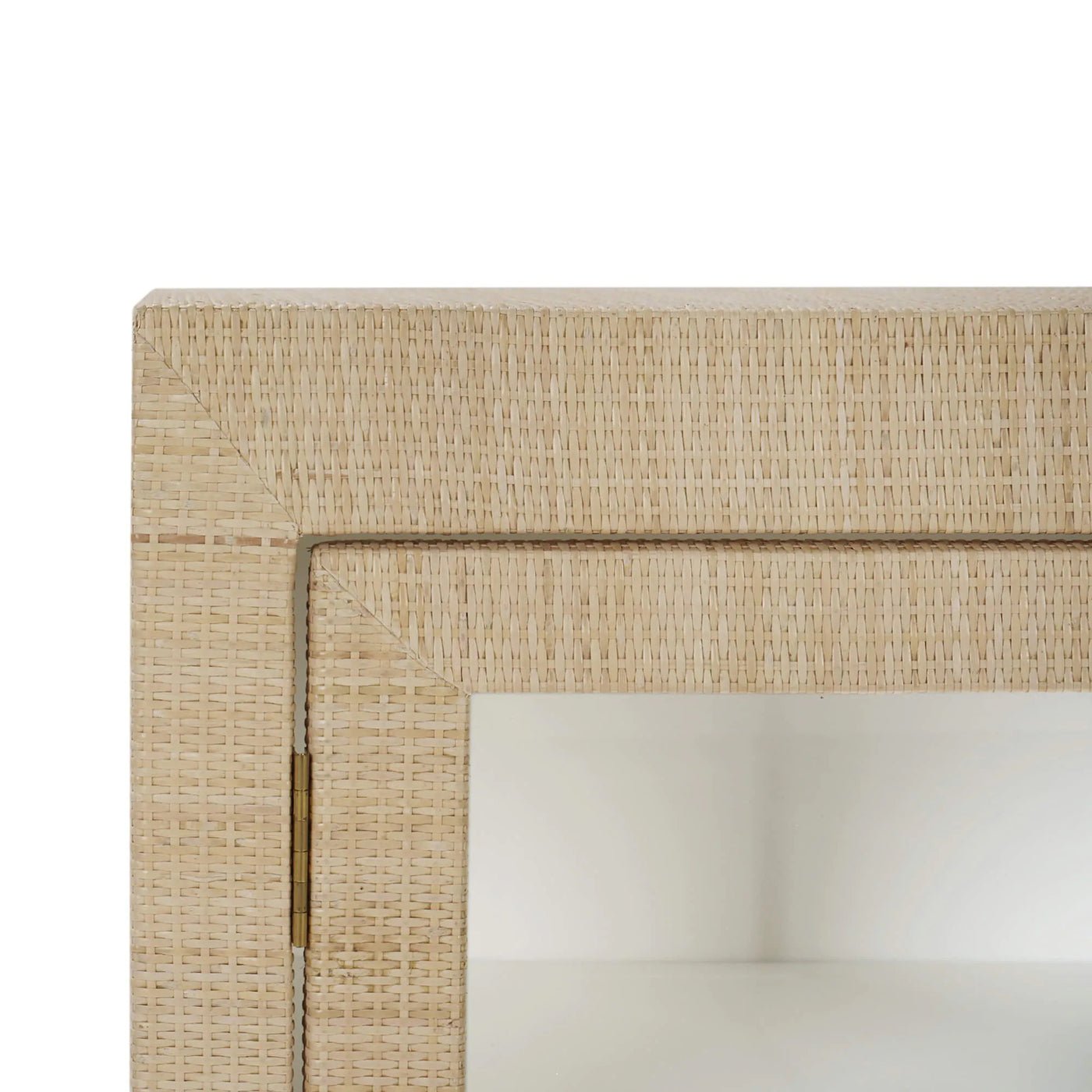 Close-up of rattan cabinet corner detail.