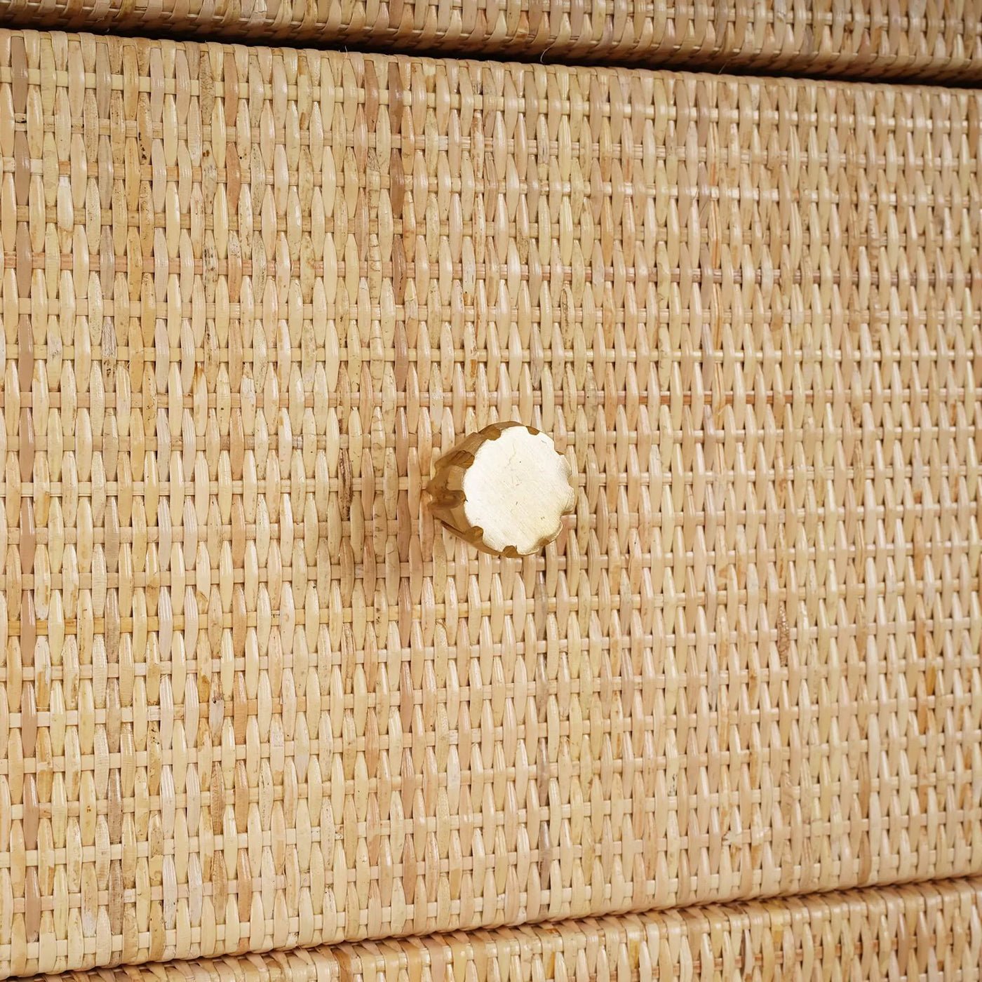 Rattan cabinet drawer knob close-up with texture.