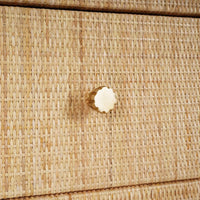 Rattan cabinet drawer knob close-up with texture.