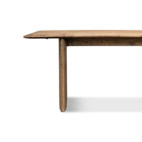 Profile view of reclaimed pine dining table, side leg focus.