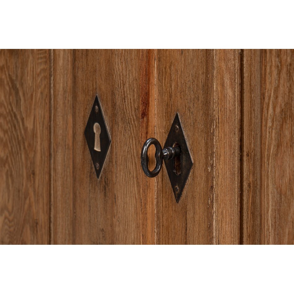 Key and lock detail of reclaimed pine side cabinet doors.