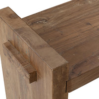 Close-up of the bench seat meeting a raised reclaimed wood end panel with a projecting rectangular joint