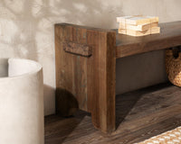 Room detail of the reclaimed wood bench end showing the raised panel, projecting joint and notched feet
