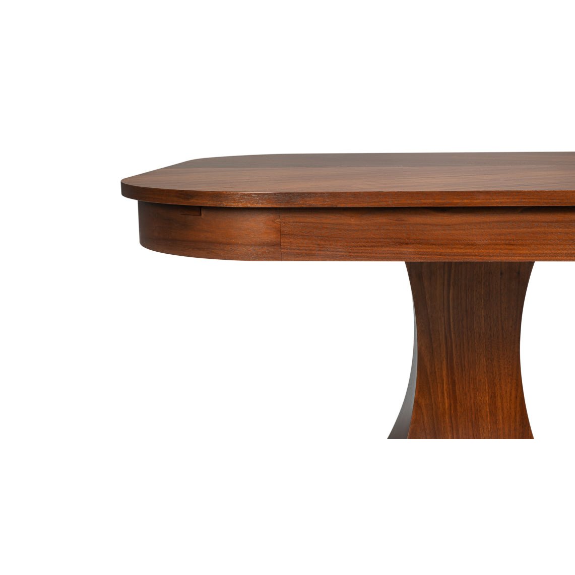 Close-up of dining table edge and pedestal.
