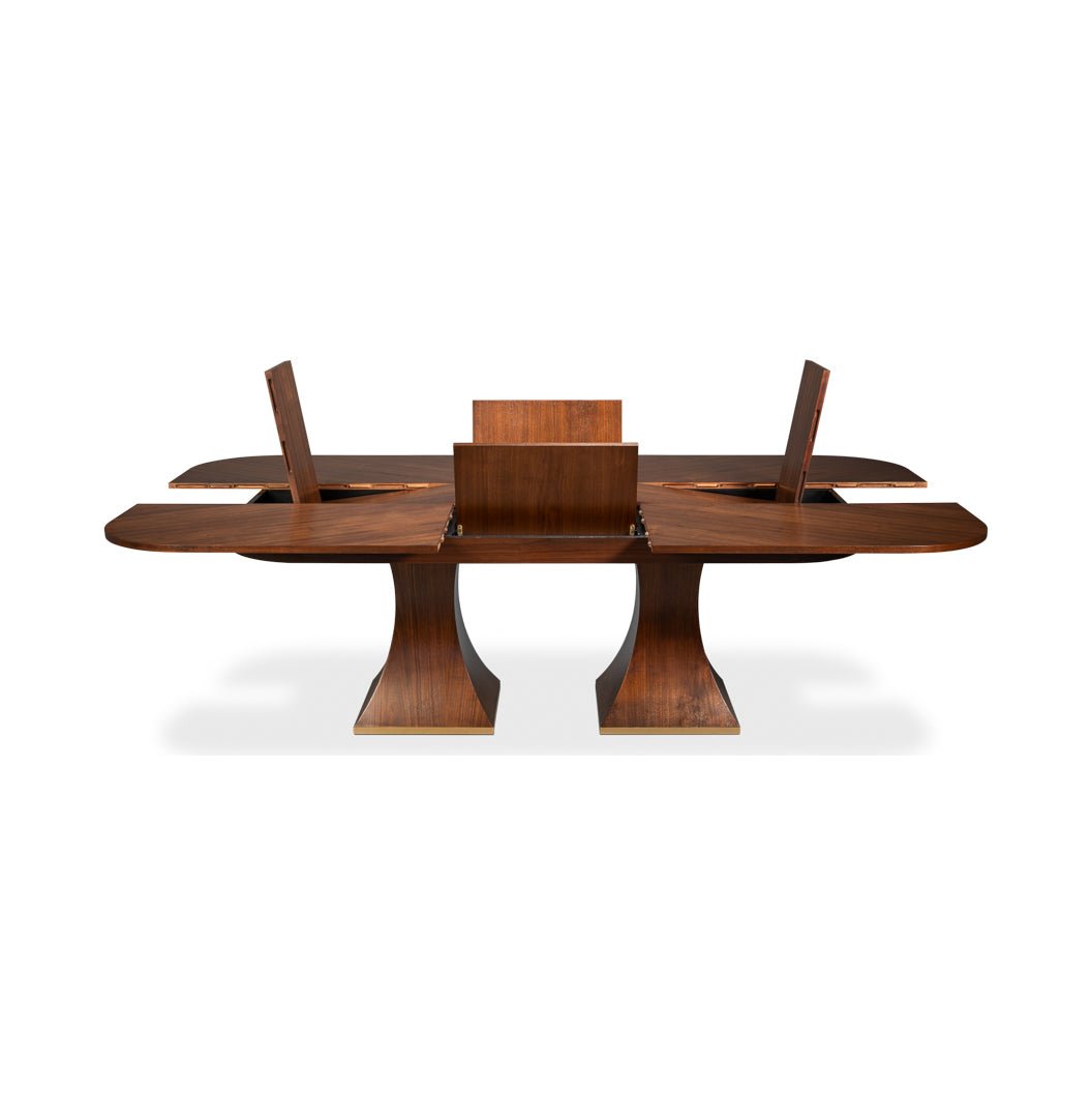Rectangular walnut table opening with leaves extended.