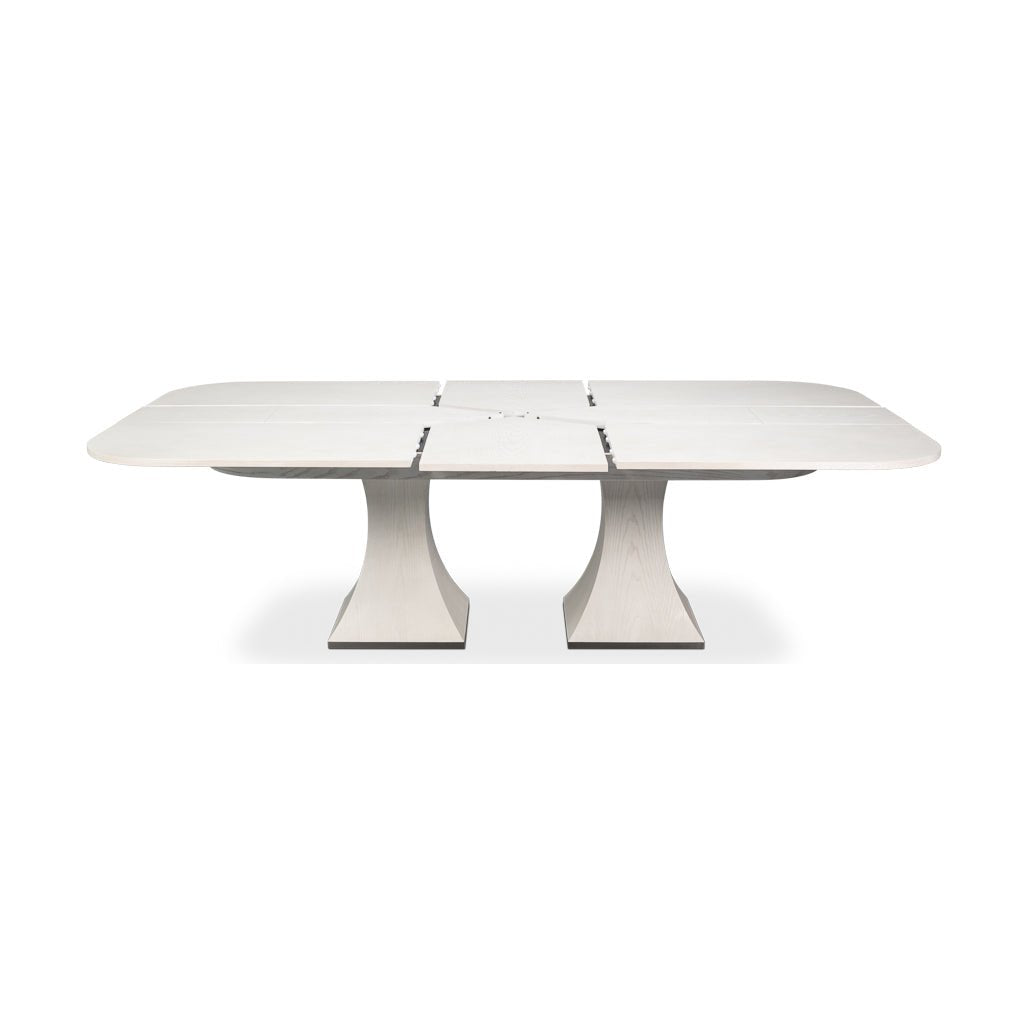 Dining table extended with leaf mechanism partially open.