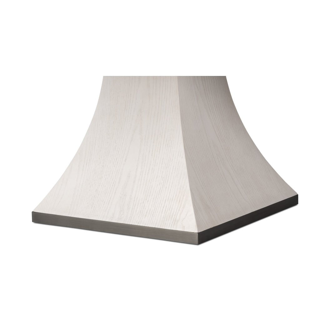 Close-up of the dining table's pedestal base design.