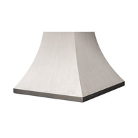 Close-up of the dining table's pedestal base design.