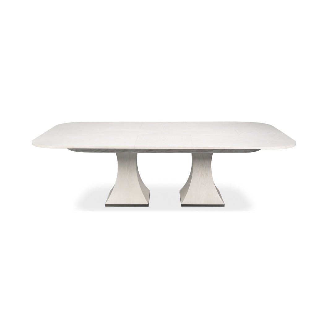 Front view of a rectangular white dining table.