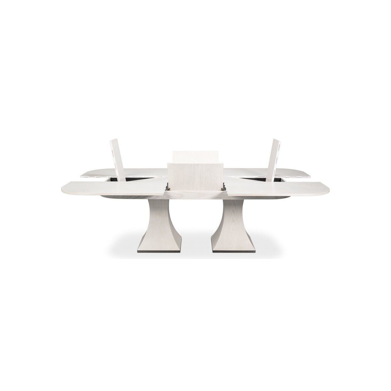 Dining table with extended leaves and support mechanism visible.