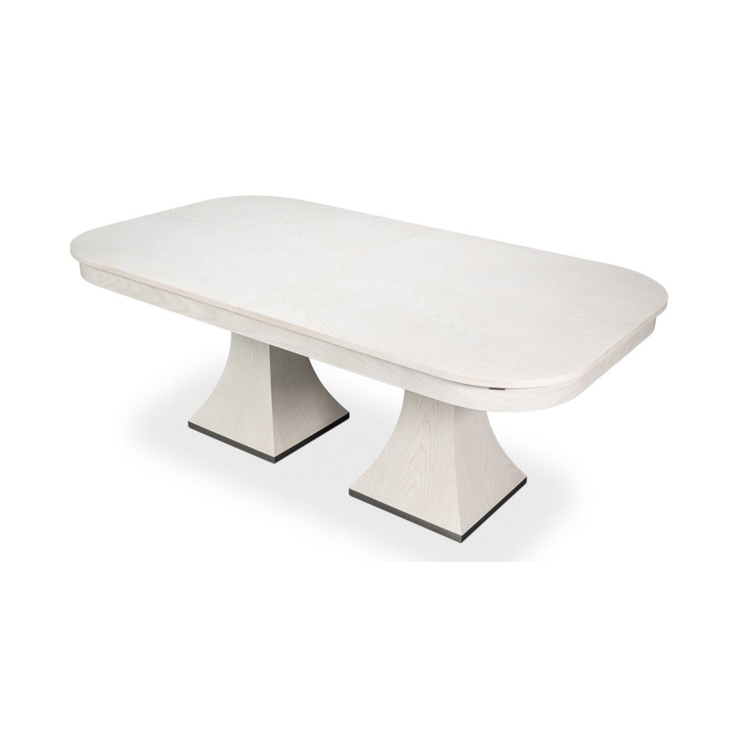 Angled view of the rectangular white dining table.