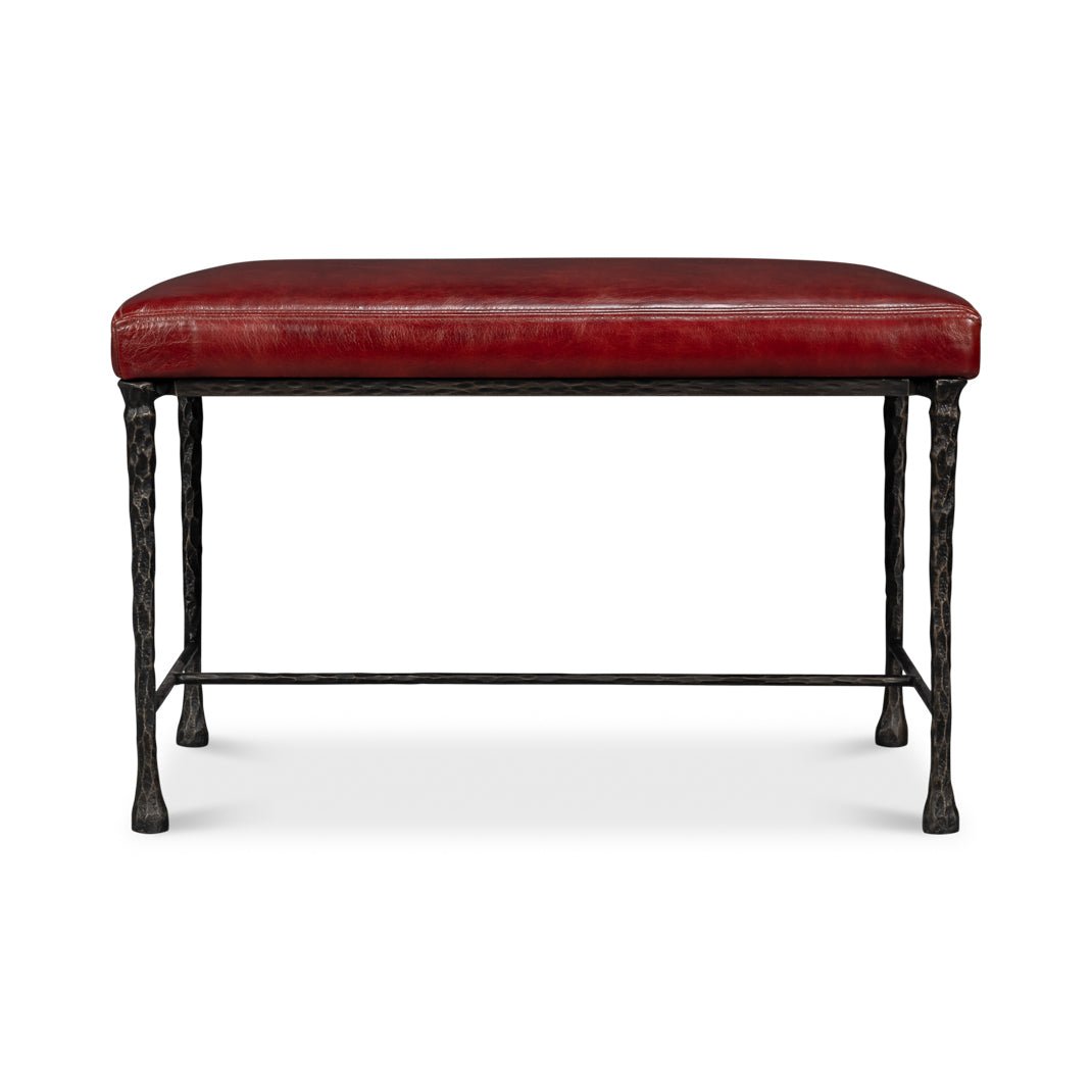 Straight front view of small bench with red leather seat.