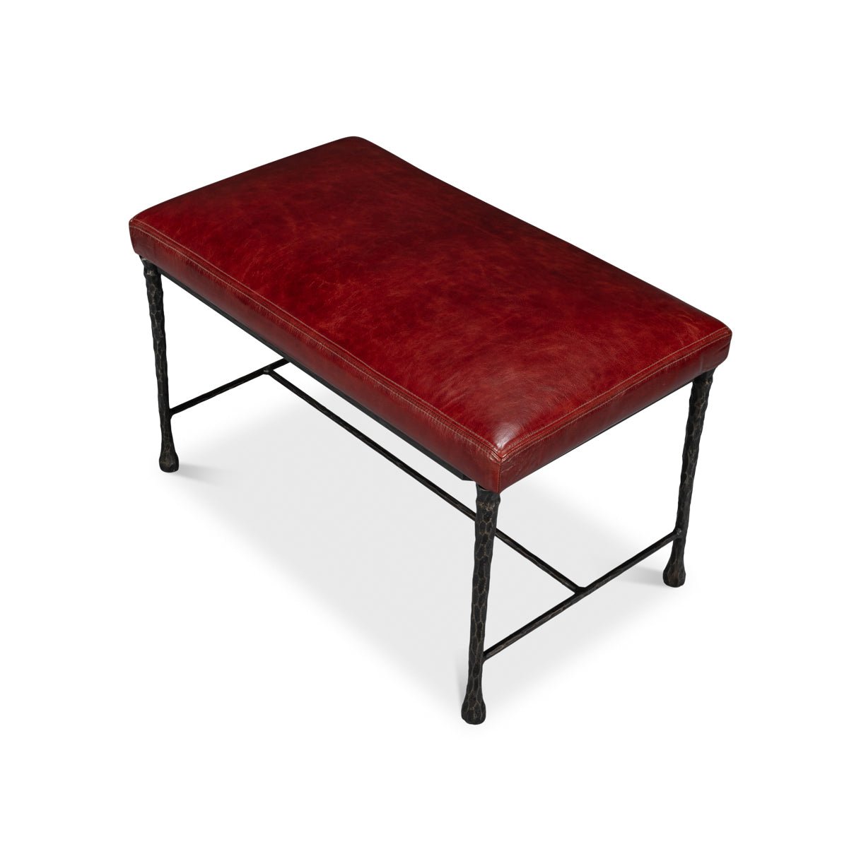 Top angle view of small bench with red leather upholstery.
