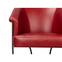Red leather tub chair seat and arm focus.