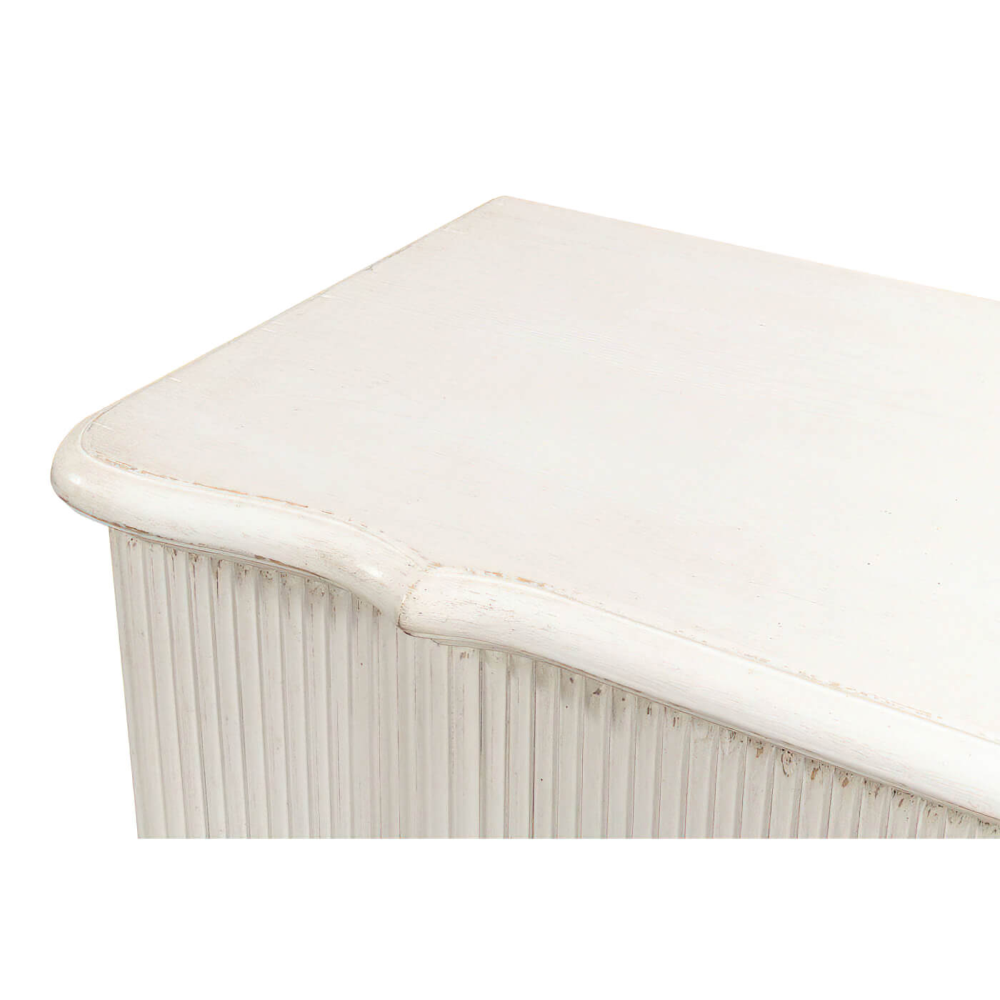 Top corner detail, reeded antique white cabinet finish.