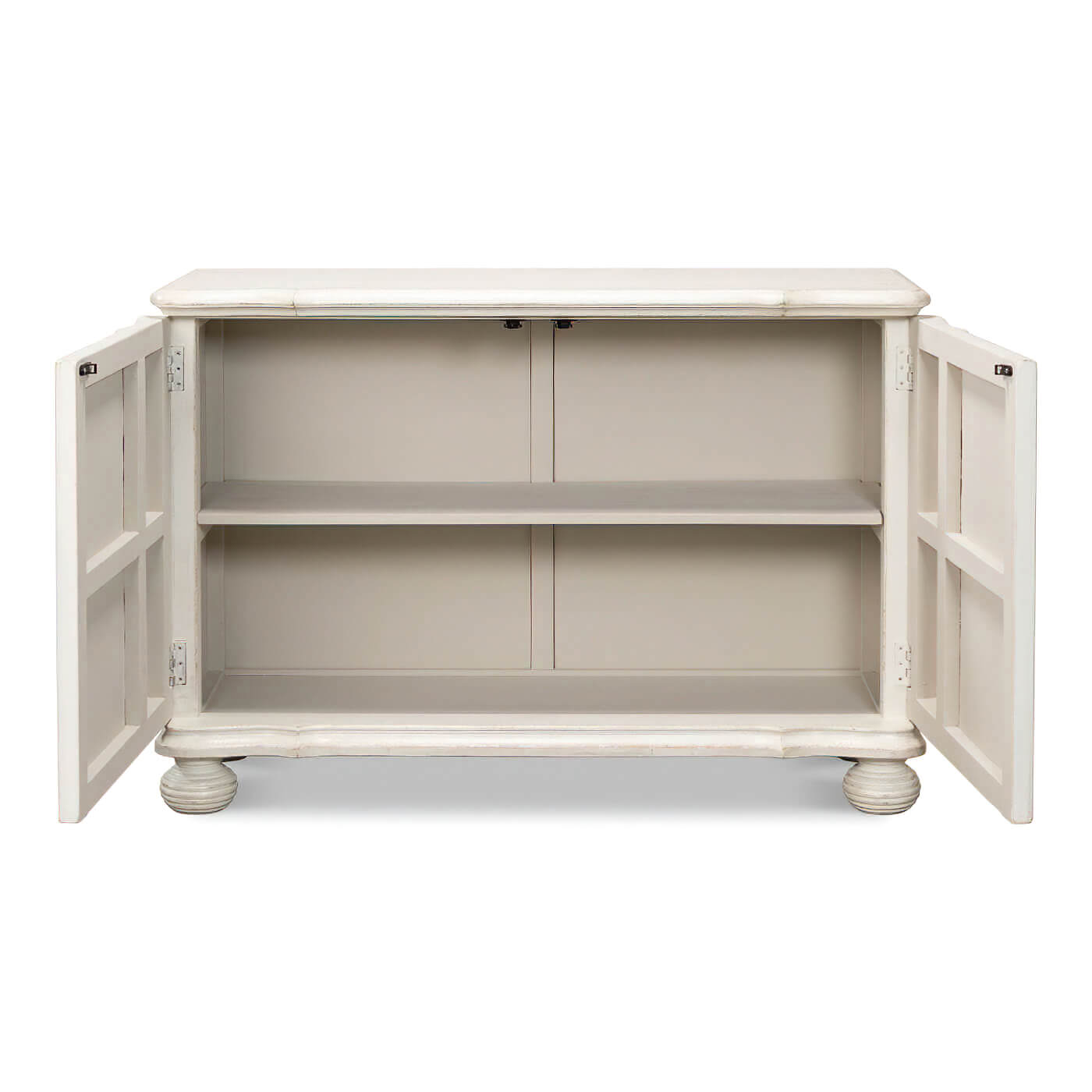 Open doors showing interior shelves, reeded antique white cabinet.
