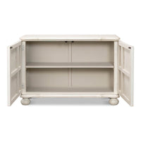 Open doors showing interior shelves, reeded antique white cabinet.