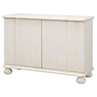 Reeded antique white cabinet angled view with closed doors.