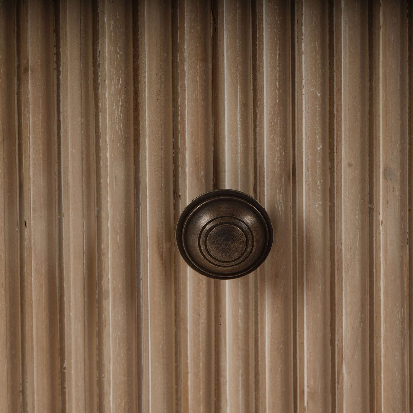 Close-up of dresser's knob, highlighting detail.