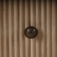 Close-up of dresser's knob, highlighting detail.