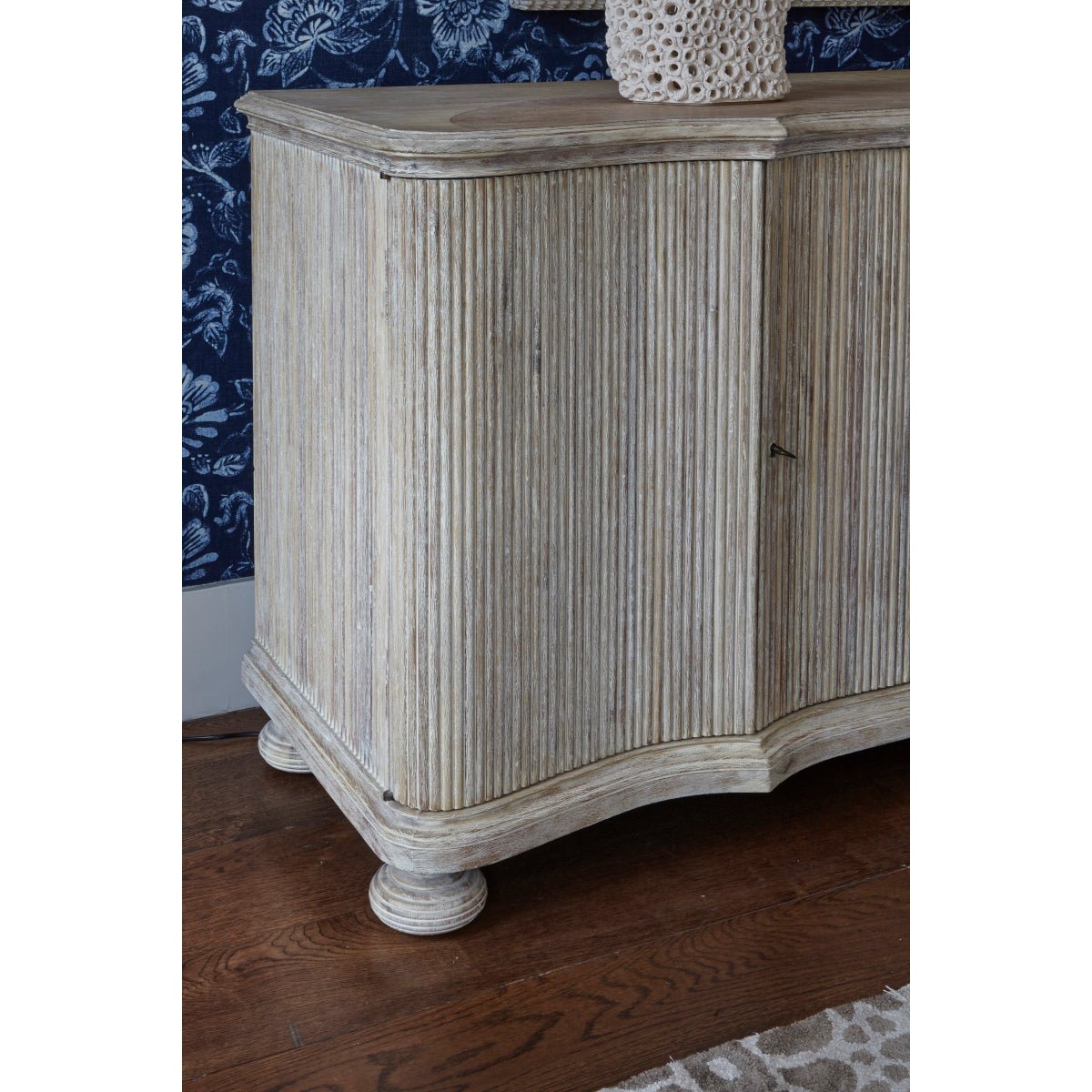 Side view of cabinet detail, highlighting reeded texture.