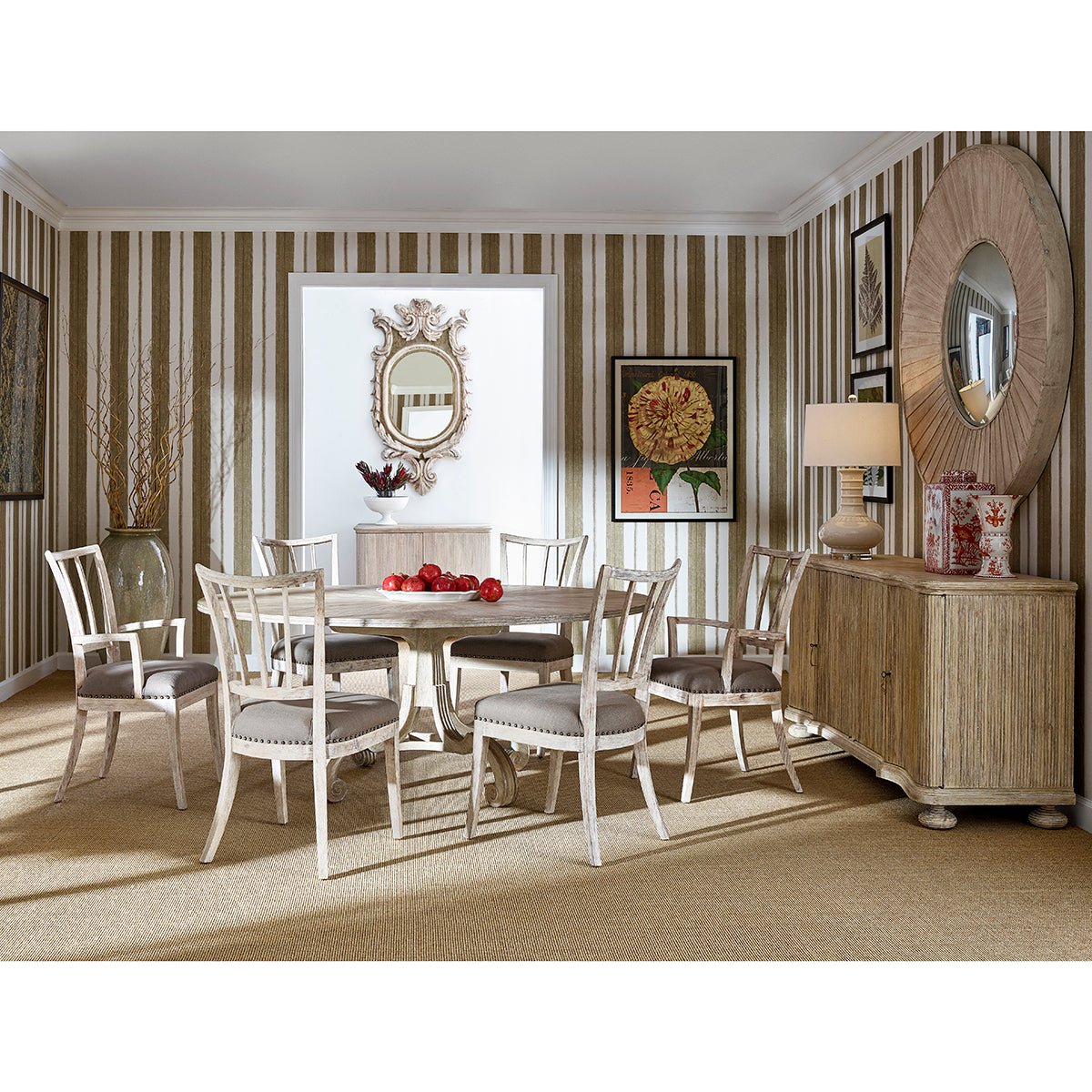 Dining room setting featuring white washed buffet cabinet.