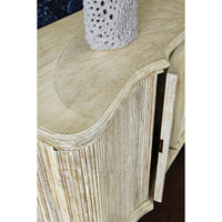 Textured top of buffet cabinet with open door detail.
