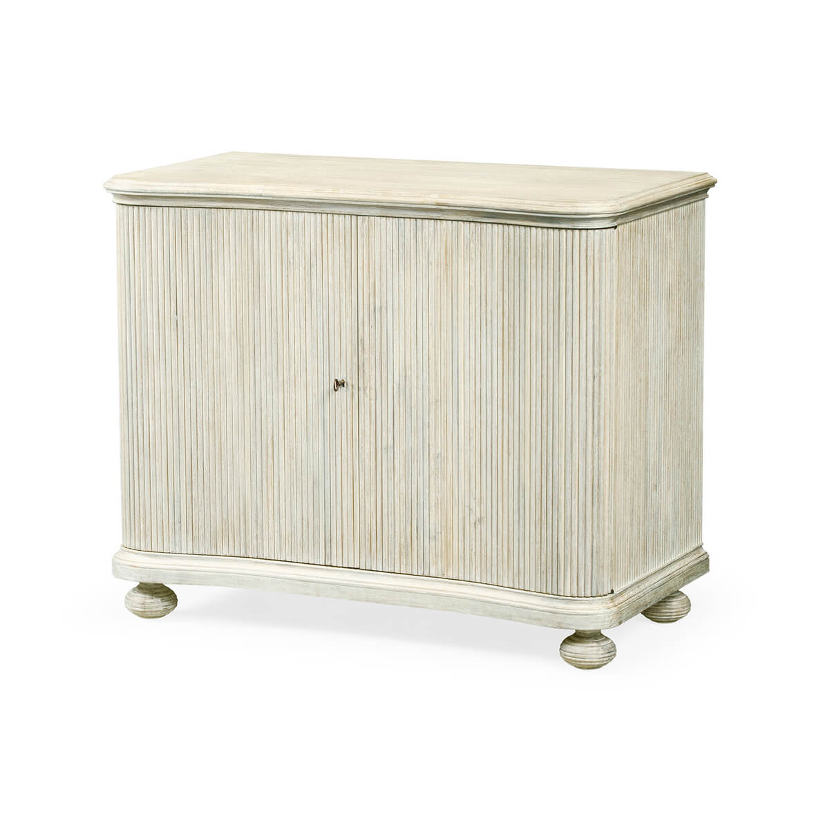 Reeded white washed cabinet, angled view, closed doors.